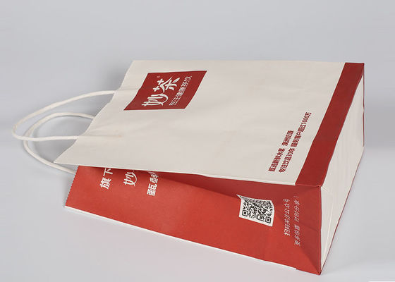 Le rouge a imprimé les sacs décoratifs, coutume réutilisés emportent les sacs à provisions de papier